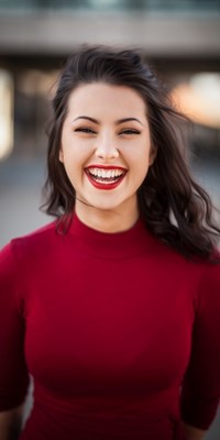Young woman in a bright red top and bright red lipstick