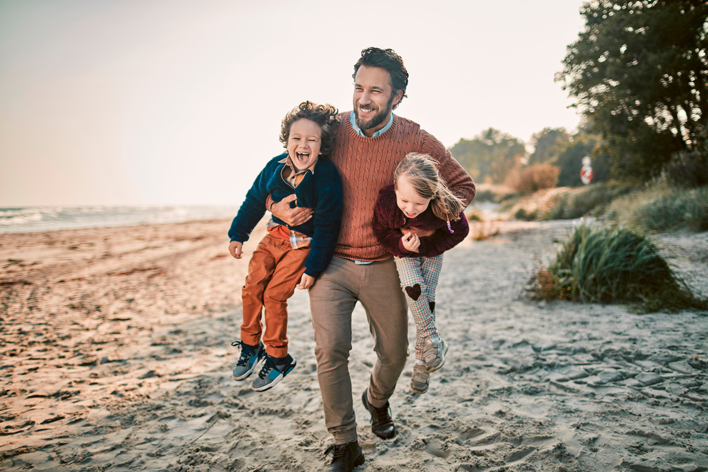 Father daughter and son on a beach