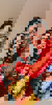 Young family playing in their home