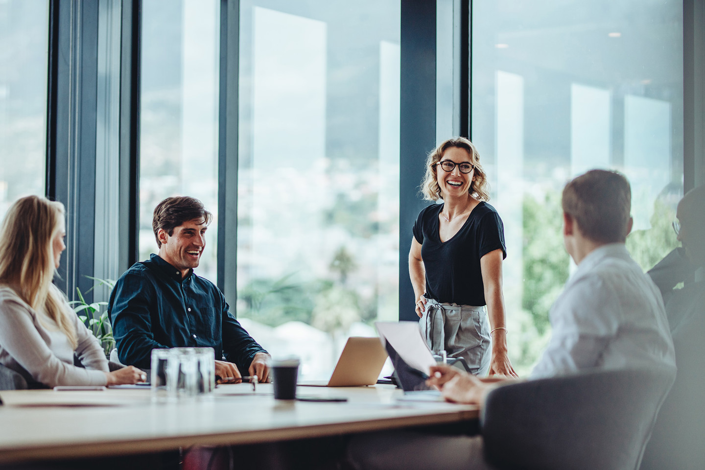 Group of young professionals in a meeting looking happy