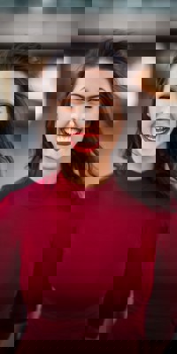 Young woman in a bright red top and bright red lipstick